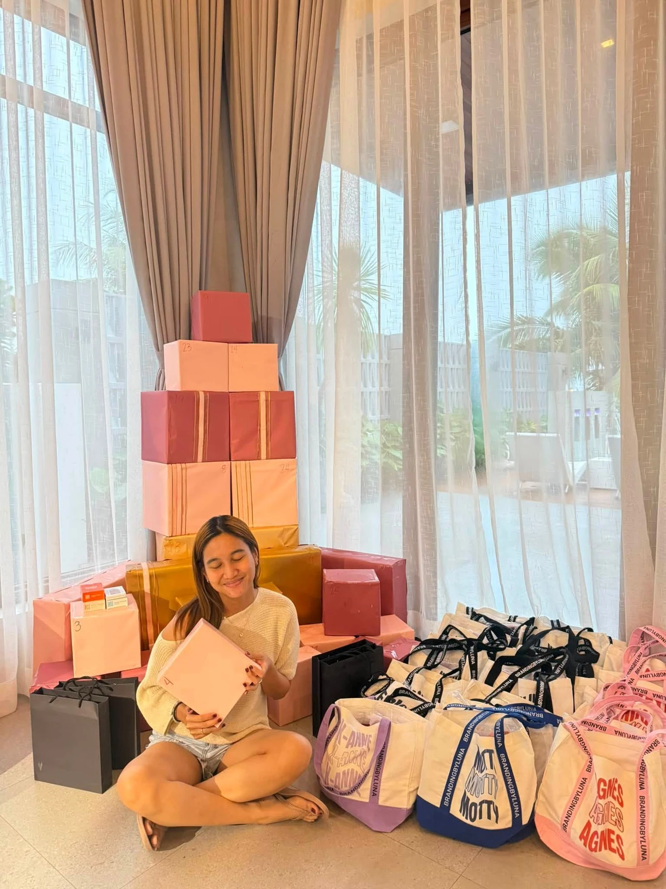 A team member beside gifts at a gathering